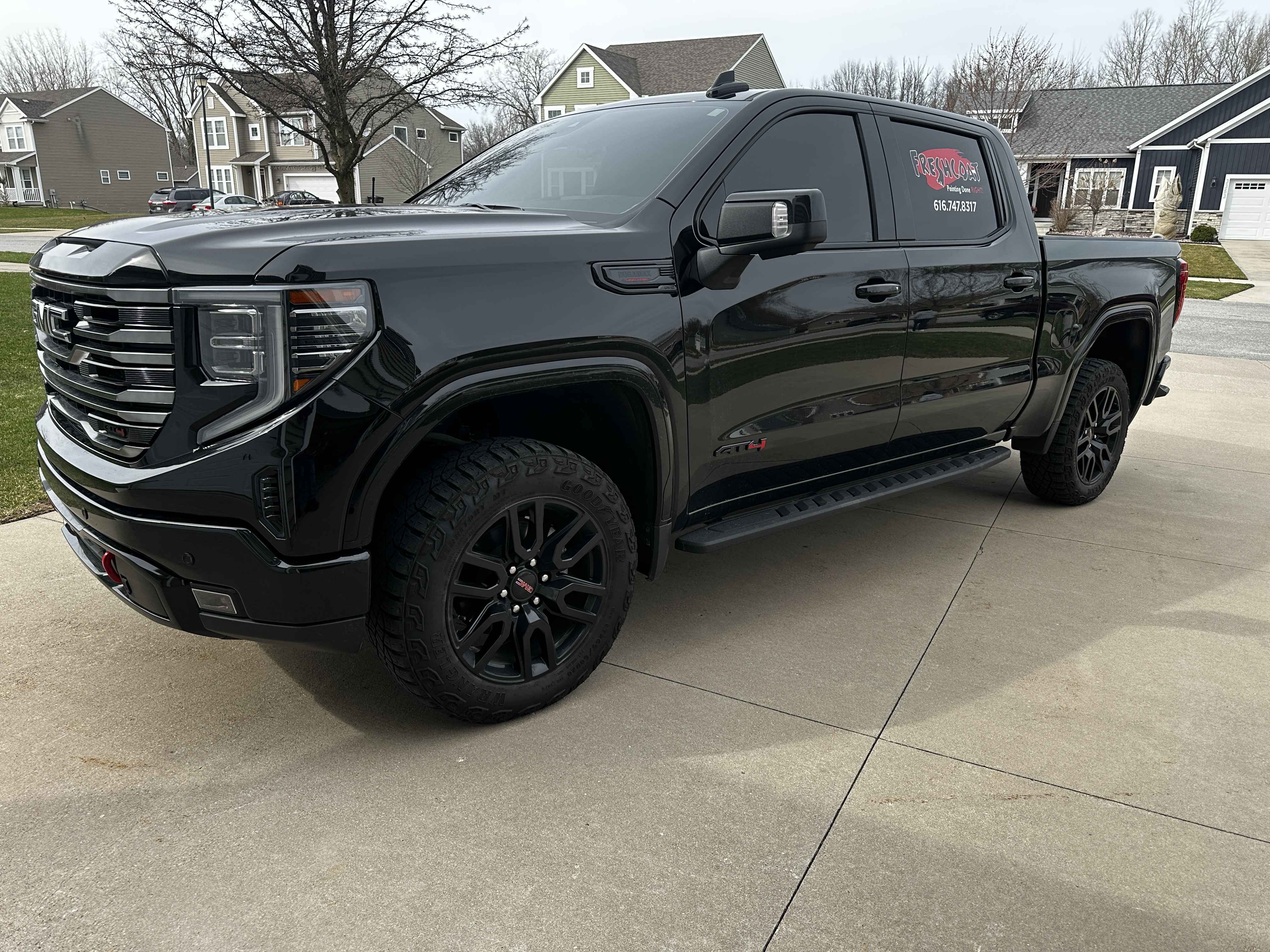 Blacked-out GMC Sierra after full detail by Grand Rapids Auto Spa